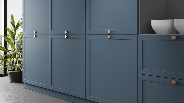 An IKEA kitchen with new replacement cabinet doors in dark blue